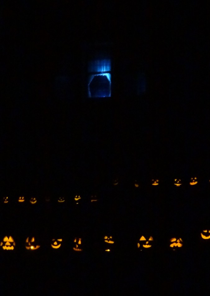 An eerie blue light illuminates the room where the murder of the last owner occurred in the mansion.